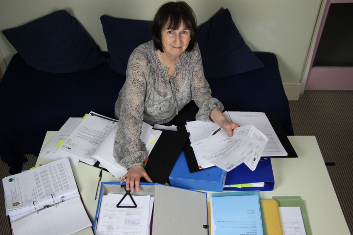 Jane with a pilae of letters